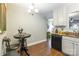 Bright kitchen with white cabinetry, granite countertops, and an open layout to the living area at 1804 Fairlawn Ct, Rock Hill, SC 29732
