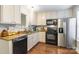 Well-equipped kitchen with granite countertops, black appliances, and ample cabinet space at 1804 Fairlawn Ct, Rock Hill, SC 29732