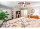 Spacious bedroom featuring hardwood floors, ceiling fan, and ample natural light, with an attached bathroom at 1804 Fairlawn Ct, Rock Hill, SC 29732
