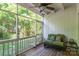 Inviting screened porch with a seating area, ceiling fan, and a tranquil view of the backyard at 1804 Fairlawn Ct, Rock Hill, SC 29732