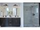 This bathroom boasts double sinks and a large glass enclosed shower with gray tiling at 2000 Plainfield Dr, Bessemer City, NC 28016