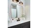 Stylish bathroom vanity with bronze fixtures, modern sink, quartz countertop, and decorative mirror at 2000 Plainfield Dr, Bessemer City, NC 28016