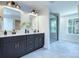 This bathroom includes double sinks, a glass enclosed shower and nice tile work at 2000 Plainfield Dr, Bessemer City, NC 28016