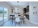 Eat in kitchen with black cabinets, sleek countertops, modern lighting, and a dining area for casual meals and gatherings at 2000 Plainfield Dr, Bessemer City, NC 28016