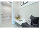 Mudroom with built-in bench, coat hooks, and shelving for organized storage and a welcoming transition space at 2000 Plainfield Dr, Bessemer City, NC 28016