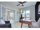 Bright home office with lots of natural light, french doors, modern ceiling fan and beautiful hardwood floors at 2000 Plainfield Dr, Bessemer City, NC 28016