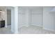 This walk-in closet is connected to a bathroom with double sinks and a tiled shower at 2000 Plainfield Dr, Bessemer City, NC 28016