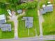 Aerial view showcases the house with a well-manicured lawn and surrounding greenery at 201 Robinson Rd, Gastonia, NC 28056