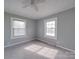 Bedroom featuring windows with blinds, ceiling fan and carpet at 201 Robinson Rd, Gastonia, NC 28056