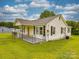 Charming single-story home featuring a covered front porch and well-maintained lawn at 201 Robinson Rd, Gastonia, NC 28056