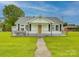 Charming single-story home features a cozy front porch and well-maintained lawn at 201 Robinson Rd, Gastonia, NC 28056