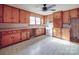 Functional kitchen with vintage wood cabinets and white appliances awaits renovation at 201 Robinson Rd, Gastonia, NC 28056