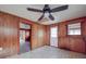 This kitchen boasts wood-paneled walls, tile flooring, and easy access to the backyard at 201 Robinson Rd, Gastonia, NC 28056