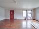 Spacious living room featuring hardwood floors, natural light, and neutral wall color at 201 Robinson Rd, Gastonia, NC 28056