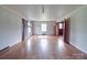 Open layout living room featuring hardwood floors, natural light, and neutral wall color at 201 Robinson Rd, Gastonia, NC 28056
