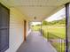 Covered front porch offering an outdoor area with green yard view at 201 Robinson Rd, Gastonia, NC 28056