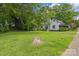 View of the expansive backyard, offering plenty of green space and mature trees at 222 W Mccubbins St, Salisbury, NC 28144