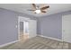 Bedroom features a ceiling fan, carpet, and one door at 222 W Mccubbins St, Salisbury, NC 28144