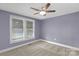 Bedroom features a ceiling fan, one window, and carpet at 222 W Mccubbins St, Salisbury, NC 28144