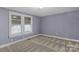 Bedroom features a ceiling light, two windows, and carpet at 222 W Mccubbins St, Salisbury, NC 28144