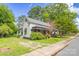 Side view of a charming home with mature trees and a well-kept lawn at 222 W Mccubbins St, Salisbury, NC 28144