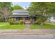 Charming home with a cozy front porch, well-maintained lawn, and mature trees adding character at 222 W Mccubbins St, Salisbury, NC 28144
