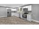Well-lit kitchen featuring granite countertops, stainless steel appliances, and ample cabinet space at 222 W Mccubbins St, Salisbury, NC 28144