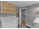 Room features wood floor, open cabinets, and a white sink at 222 W Mccubbins St, Salisbury, NC 28144