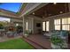 Inviting covered back porch with a swing, ceiling fan, outdoor seating, and a view of the backyard at 2221 Kenmore Ave, Charlotte, NC 28204