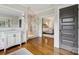 Bathroom featuring a glass shower with stone-look tile and access to a bedroom at 2221 Kenmore Ave, Charlotte, NC 28204