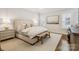 This bedroom features a large bed, custom shutters and wood floors at 2221 Kenmore Ave, Charlotte, NC 28204