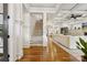 Elegant foyer with hardwood floors, grand staircase, and an open view to the living area at 2221 Kenmore Ave, Charlotte, NC 28204