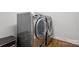 Modern laundry room with stainless steel washer and dryer, plus built in storage at 2221 Kenmore Ave, Charlotte, NC 28204