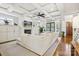 Bright and spacious living room with coffered ceilings, fireplace, and access to the outdoor patio at 2221 Kenmore Ave, Charlotte, NC 28204
