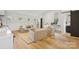 Spacious room featuring hardwood floors, comfortable seating, natural light, and a workspace with dual monitors at 2221 Kenmore Ave, Charlotte, NC 28204