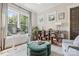 Stylish home office with ample natural light, custom shelving, and a comfortable seating area at 2221 Kenmore Ave, Charlotte, NC 28204