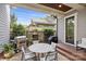 Outdoor dining area featuring a stone fireplace, built-in grill, and a round table with seating for four at 2221 Kenmore Ave, Charlotte, NC 28204