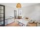 Bright playroom featuring neutral tones, a modern light fixture, and a cozy sofa at 2221 Kenmore Ave, Charlotte, NC 28204