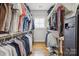 This walk-in closet features custom shelving and hanging bars for optimal organization at 2221 Kenmore Ave, Charlotte, NC 28204