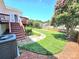 Spacious backyard with a wood deck, landscaping, and a privacy fence, perfect for outdoor gatherings and relaxation at 2226 Elendil Ln, Charlotte, NC 28269