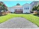 Expansive backyard featuring a wooden deck, patio and fresh green grass at 2226 Elendil Ln, Charlotte, NC 28269