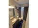 Cozy bathroom featuring a vanity, toilet, shower, and anchor-themed shower curtain at 2226 Elendil Ln, Charlotte, NC 28269