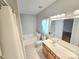 Bright bathroom featuring a tub, toilet, single vanity and tile floors at 2226 Elendil Ln, Charlotte, NC 28269
