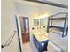 Bathroom with a vanity, a toilet, and decorative shelving and a mirror; hall way visible at 2226 Elendil Ln, Charlotte, NC 28269