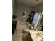 Bathroom featuring a tub, single sink, tile floor and decorative floral accents at 2226 Elendil Ln, Charlotte, NC 28269