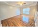 Spacious bedroom with hardwood flooring, natural light, fan, tray ceilings and large window at 2226 Elendil Ln, Charlotte, NC 28269