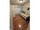 Cozy bedroom with hardwood floors and a comfortable twin bed at 2226 Elendil Ln, Charlotte, NC 28269