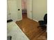 Spacious bedroom with hardwood flooring, multiple closets, and neutral walls at 2226 Elendil Ln, Charlotte, NC 28269