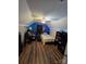Attic bedroom featuring slanted ceilings, hardwood flooring, and blue LED lighting at 2226 Elendil Ln, Charlotte, NC 28269