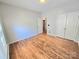 Spacious bedroom featuring hardwood floors, closet, and ample natural light at 2226 Elendil Ln, Charlotte, NC 28269